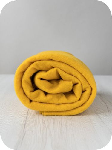 Premium Yolk merino wool prefelt in a vibrant warm yellow shade, approx A4 size, imported from the DHG dyehouse in Italy.