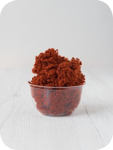 rust orange wool nepps in a 5g portion for adding texture to felting and spinning projects