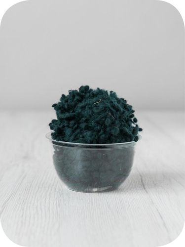 green wool nepps in a 5g portion for adding texture to felting and spinning projects