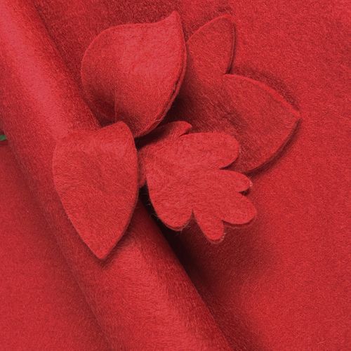 Deep Crimson wool-blend felt sheet shown with decorative leaf cut-outs to highlight its soft texture and clean-edge quality.