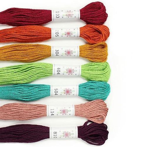 A collection of seven Sublime "Parlour" embroidery floss skeins in skin and hair tones.