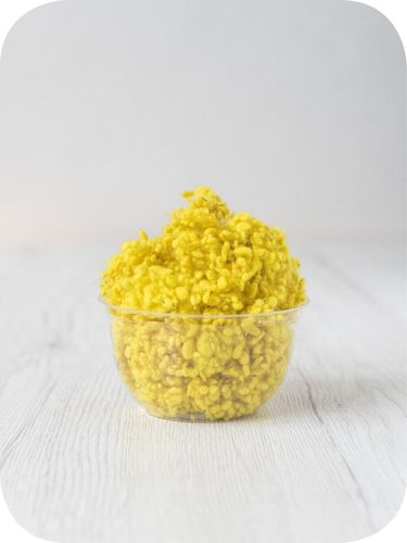 sun yellow wool nepps in a 5g portion for adding texture to felting and spinning projects