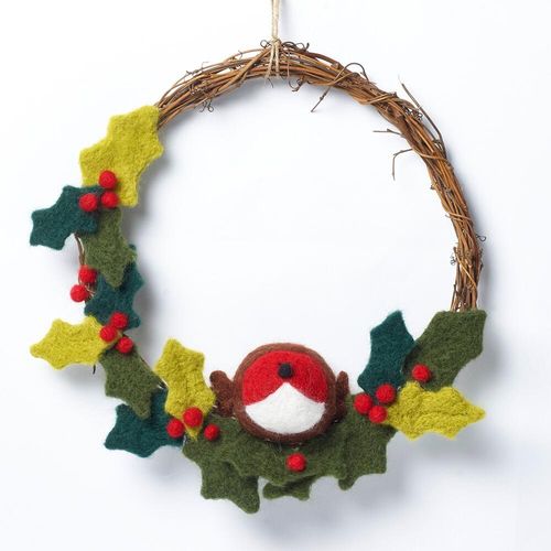Winter-themed needle felting kit featuring a round twig base, a plump 3D Robin nestled at the bottom, and variegated green felted holly leaves with clusters of small red berries.