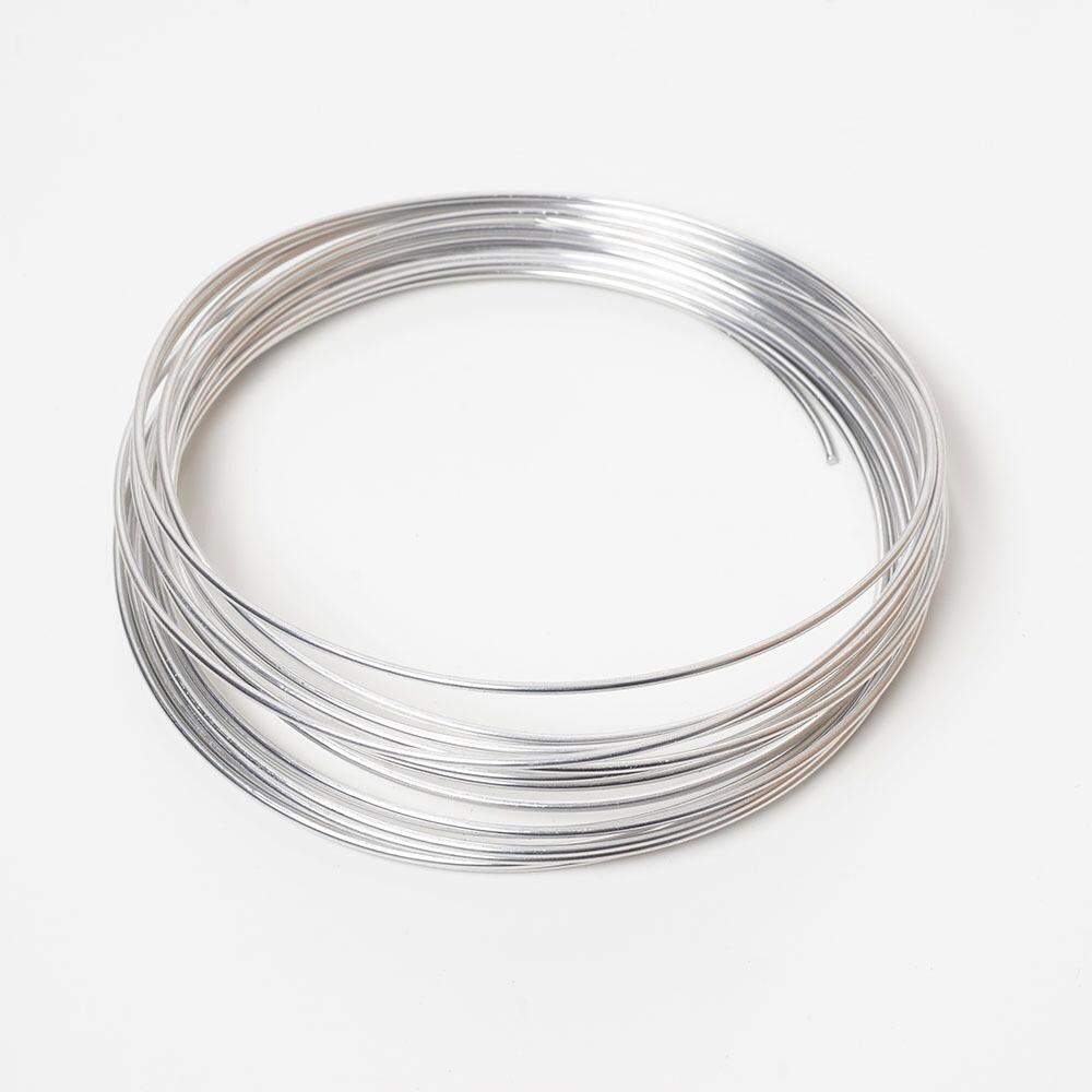 A coil of bright, silver 2mm aluminium armature wire for needle felting.