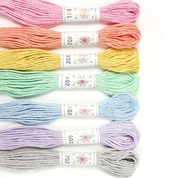 Premium Sublime embroidery threads in the "Frosting" palette, featuring seven soft pastel shades including pink, peach, lemon, mint, sky blue, lilac, and silver-grey.