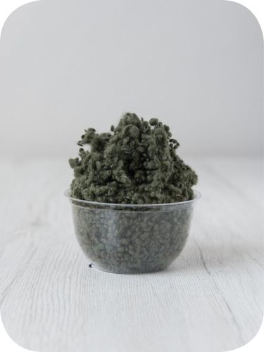 green wool nepps in a 5g portion for adding texture to felting and spinning projects