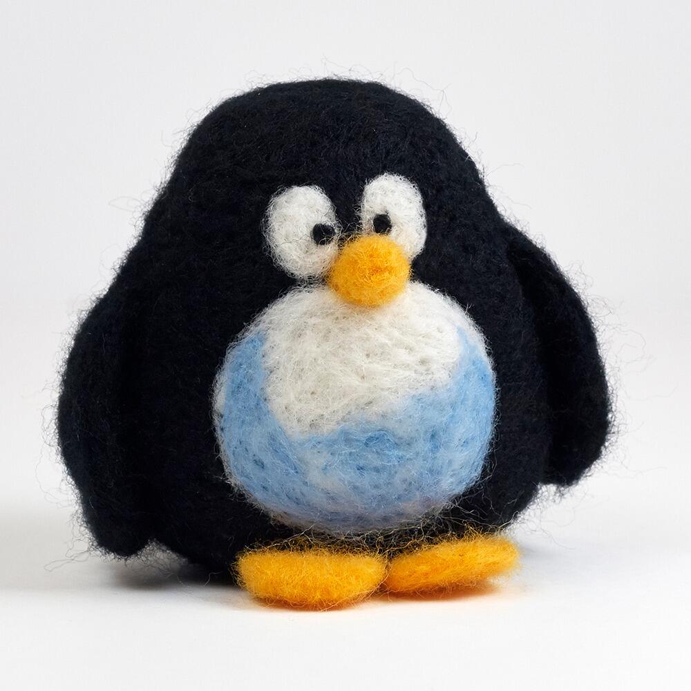 A 3D needle-felted penguin named Pongwin with a black body, a white and pale blue tummy, and bright orange feet.