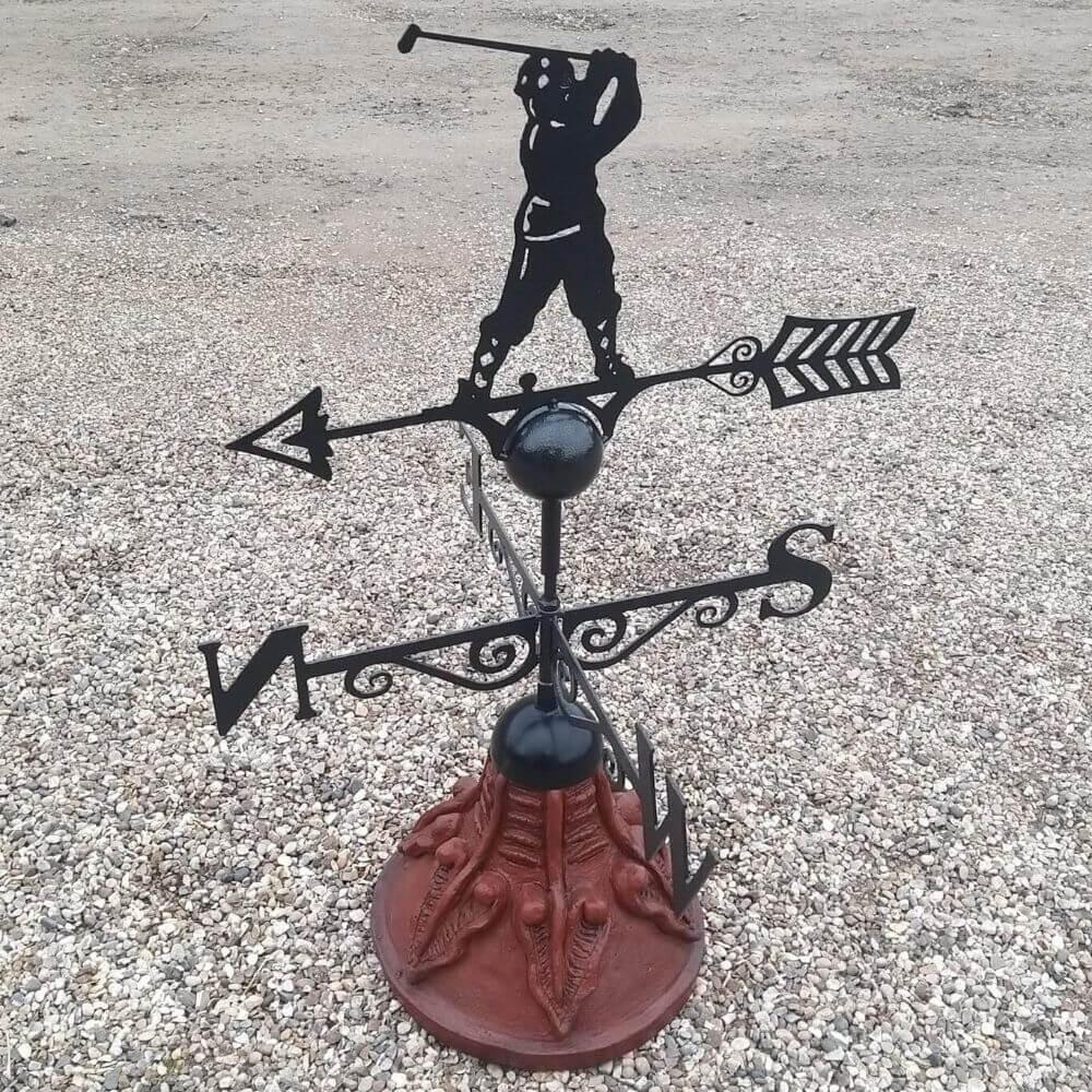 Golfer weathervane fixed on a round ridge tile cap