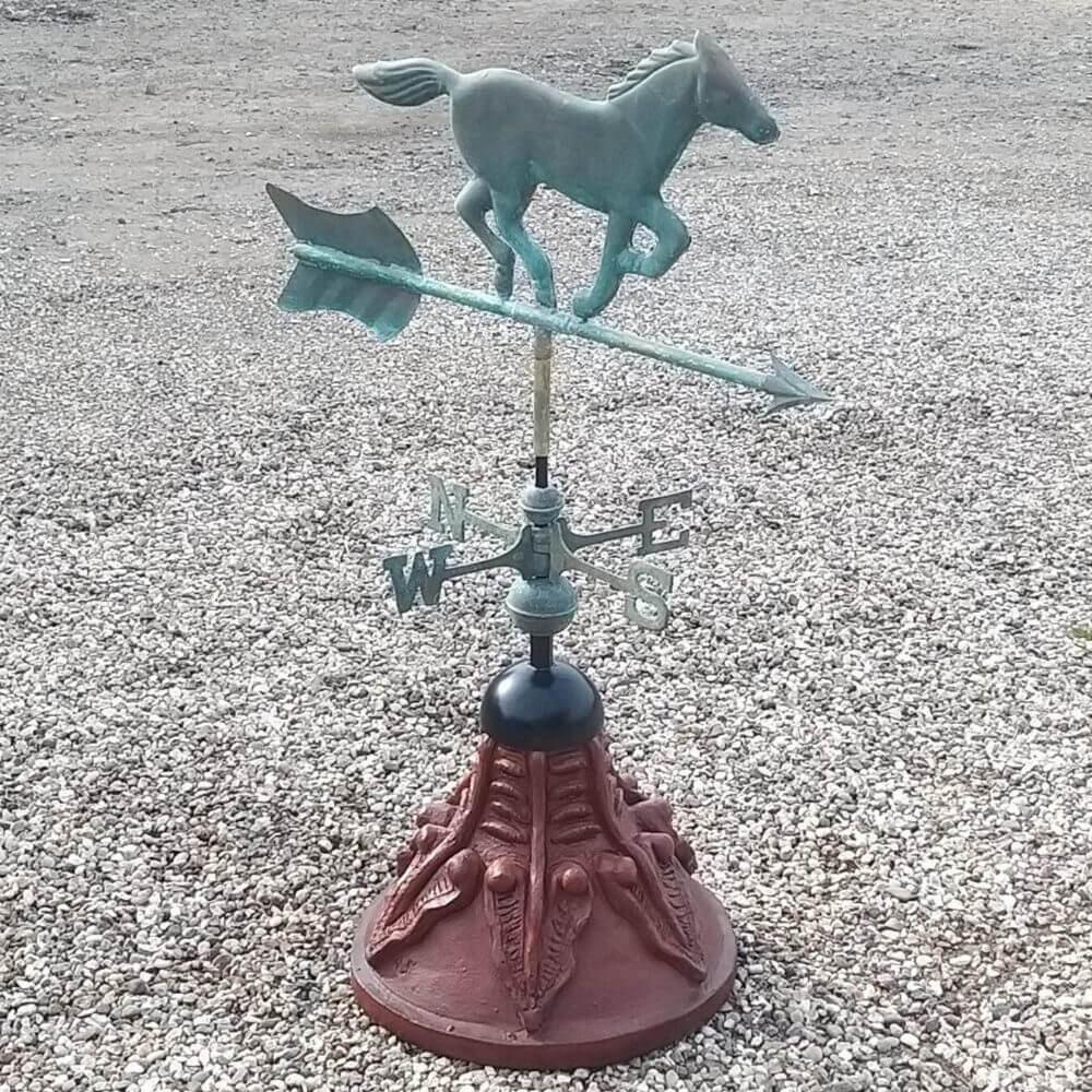 Horse weathervane installed on a round ridge tile cap
