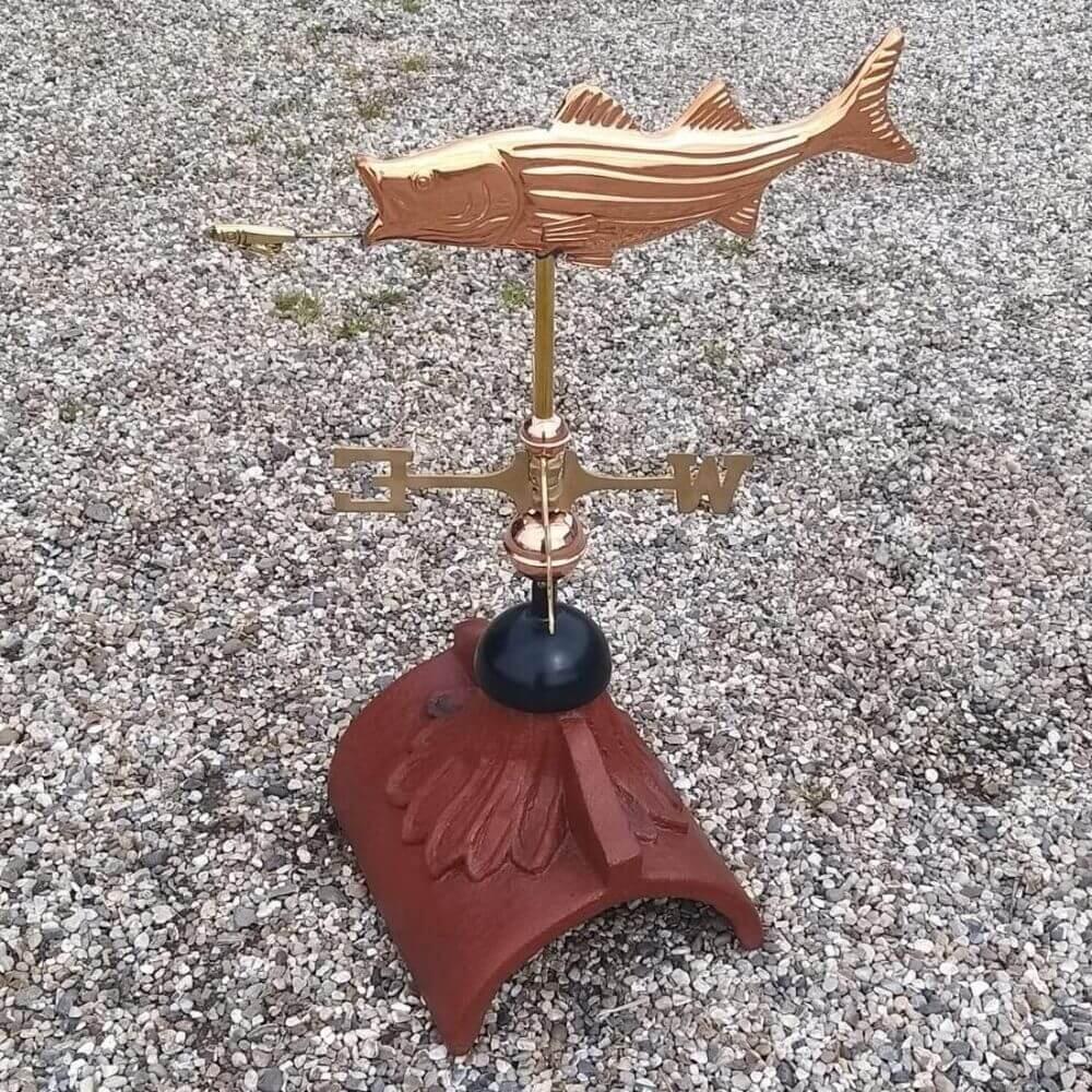 Fish weathervane mounted on a half round