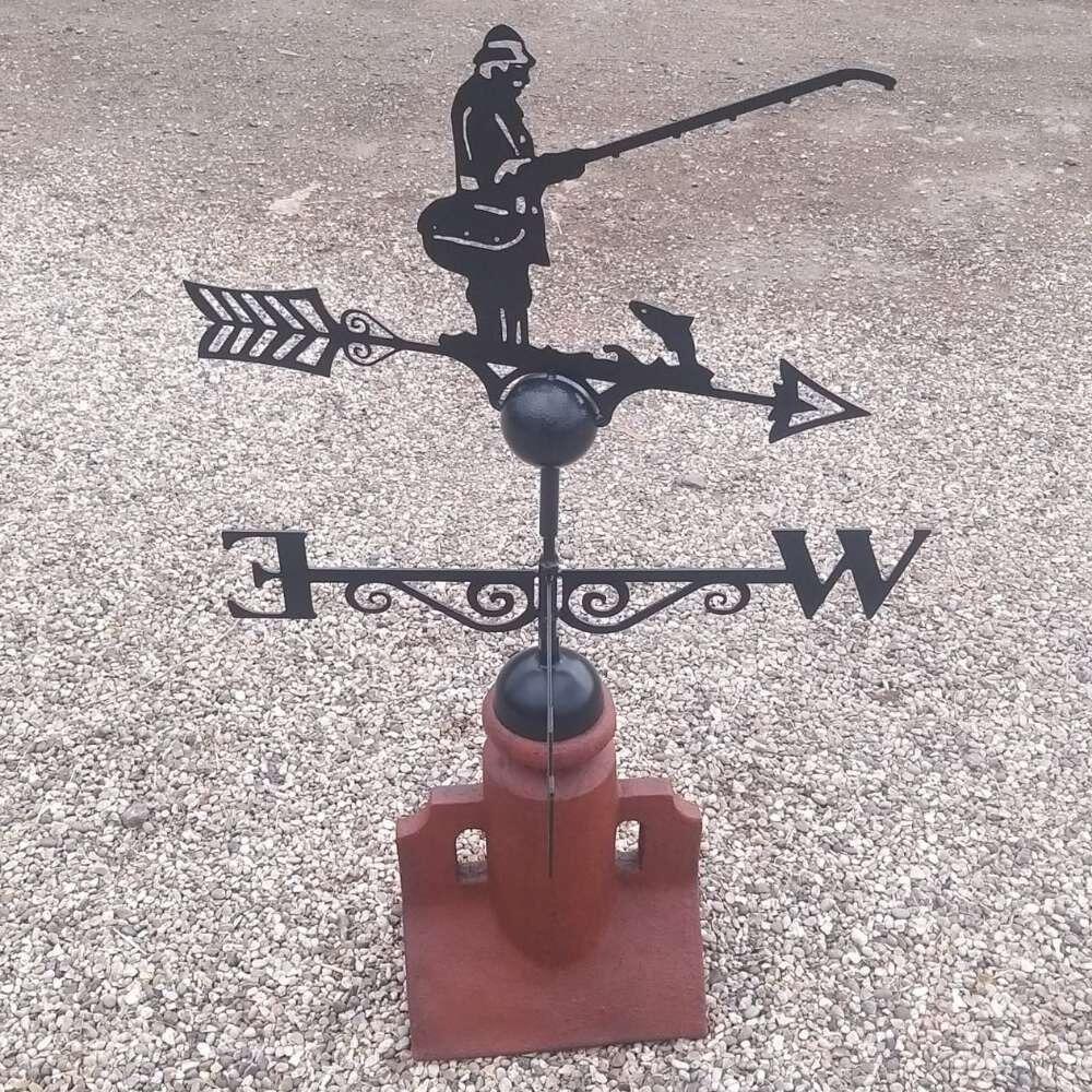 Fisherman weathervane fixed on a 45 degree ridge tile finial