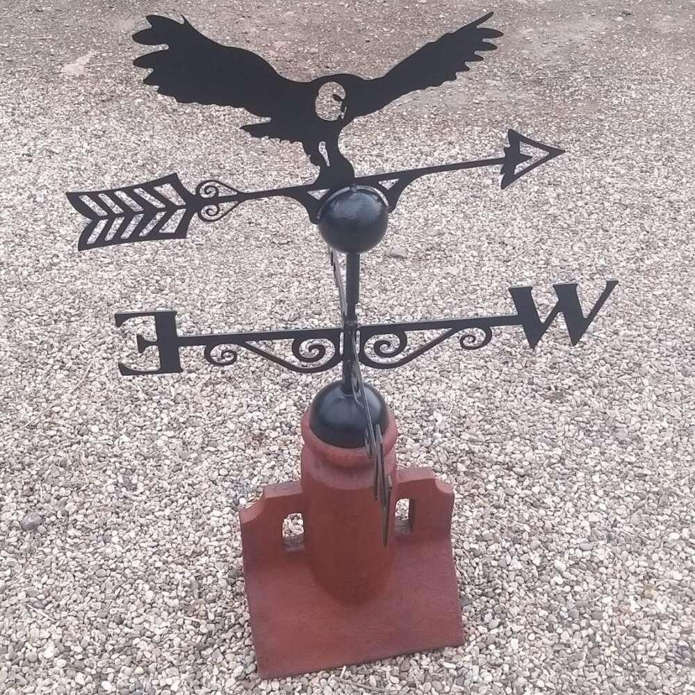 Owl weathervane fixed on a 45 degree ridge tile finial