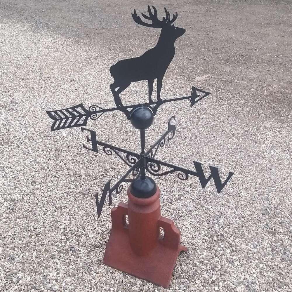 Stag weathervane fixed on a 45 degree ridge tile finial
