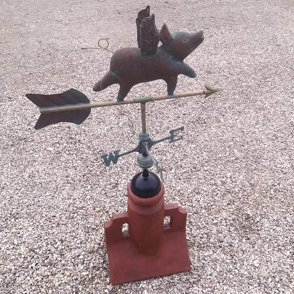 Flying pig verdigris weathervane supplied on a 90 degree ridge tile
