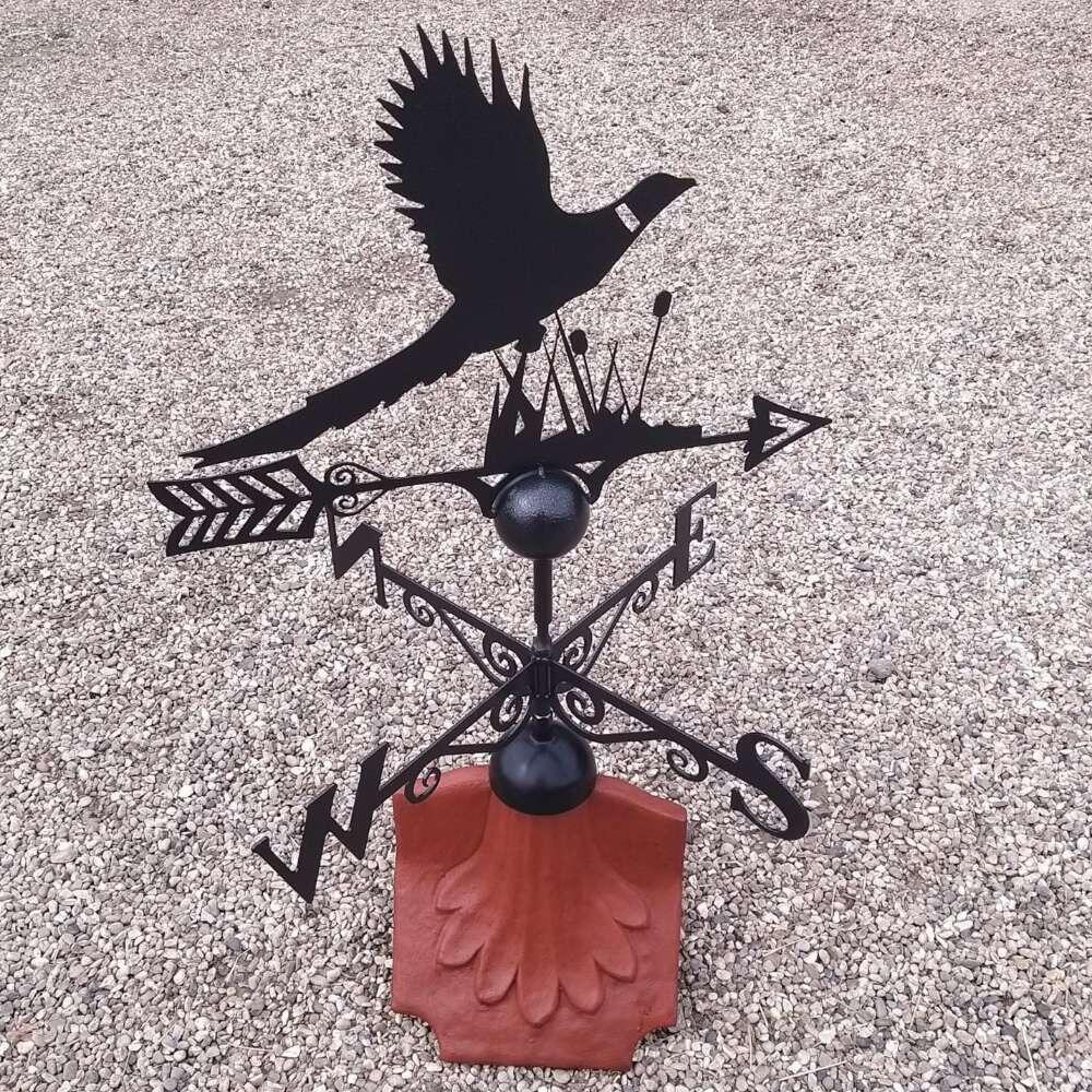 Pheasant weathervane on a ridge tile finial fitting with multiple angle options