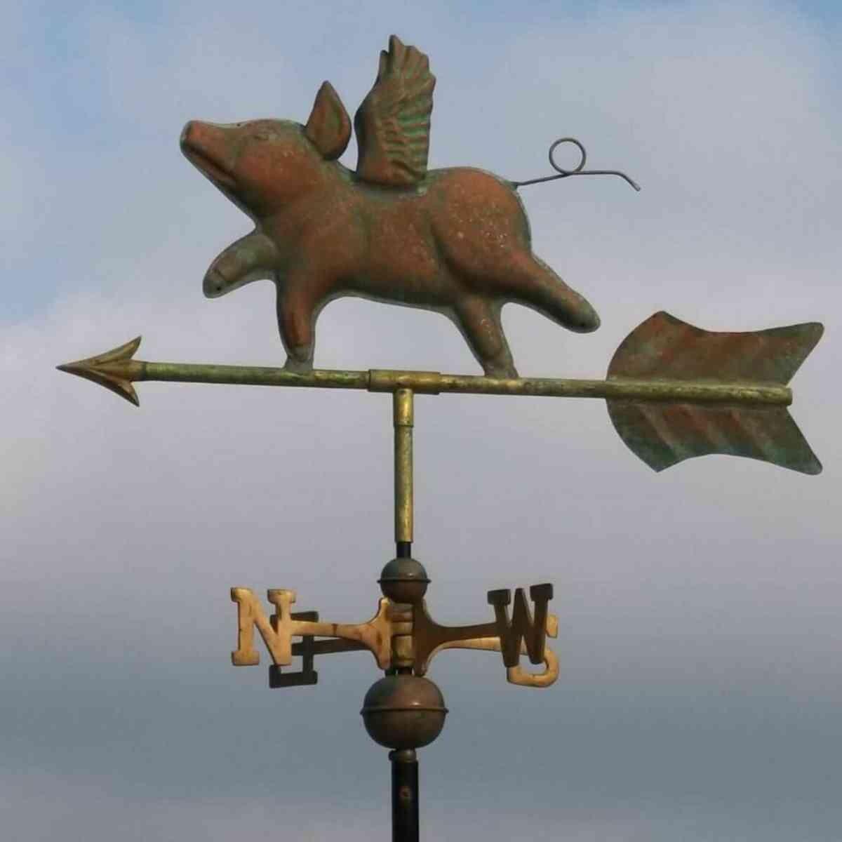 Medium aged copper flying pig weathervane