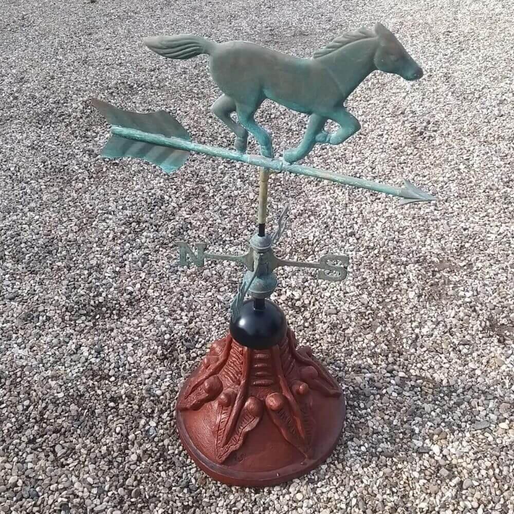 Horse weathervane installed on a round ridge tile capping