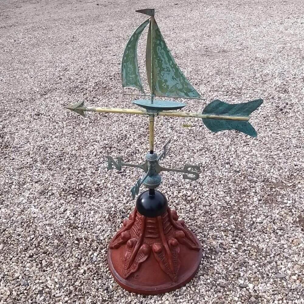 Sailboat weathervane supplied with a round ridge tile base