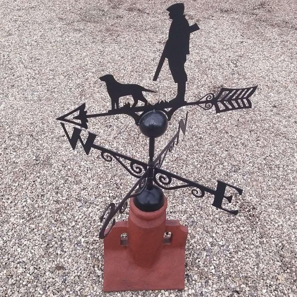 Hunting dog weathervane on a 45 degree ridge tile finial