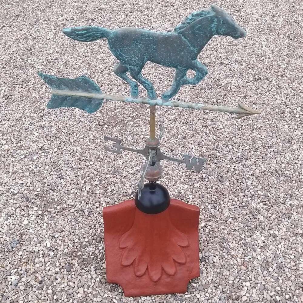 Horse verdigris weathervane fitted on a ridge tile finial fitting with multiple angle options