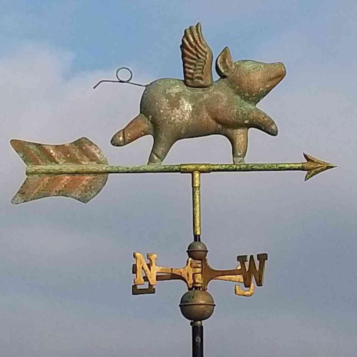 Medium aged copper flying pig weathervane
