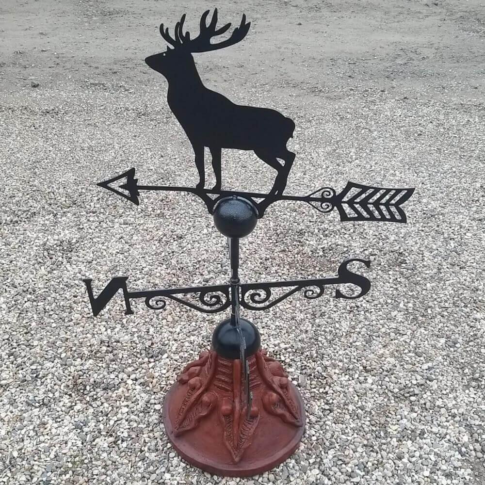 Stag weathervane mounted on a round ridge tile base