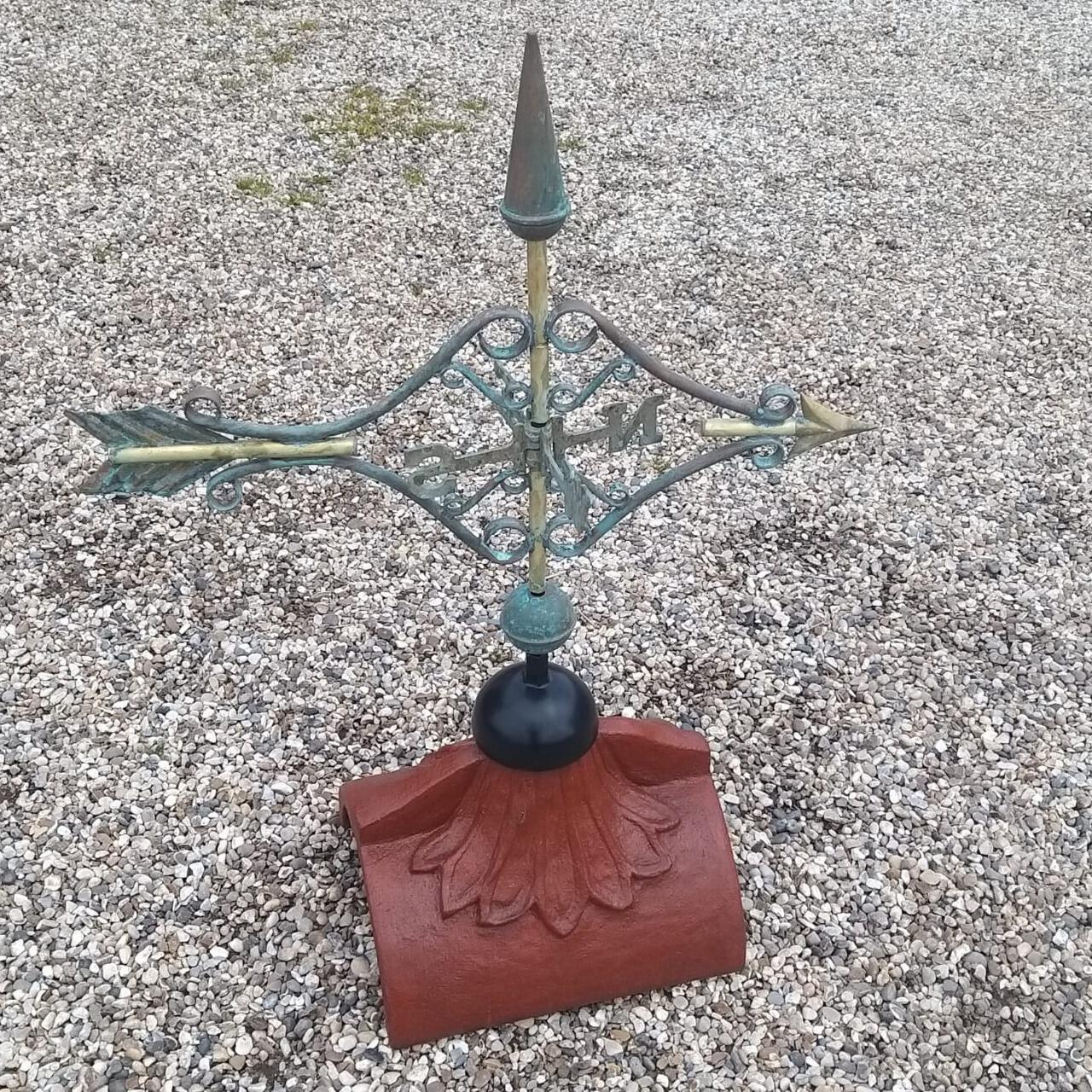 Copper Victorian arrow weathervane supplied on a half round ridge tile