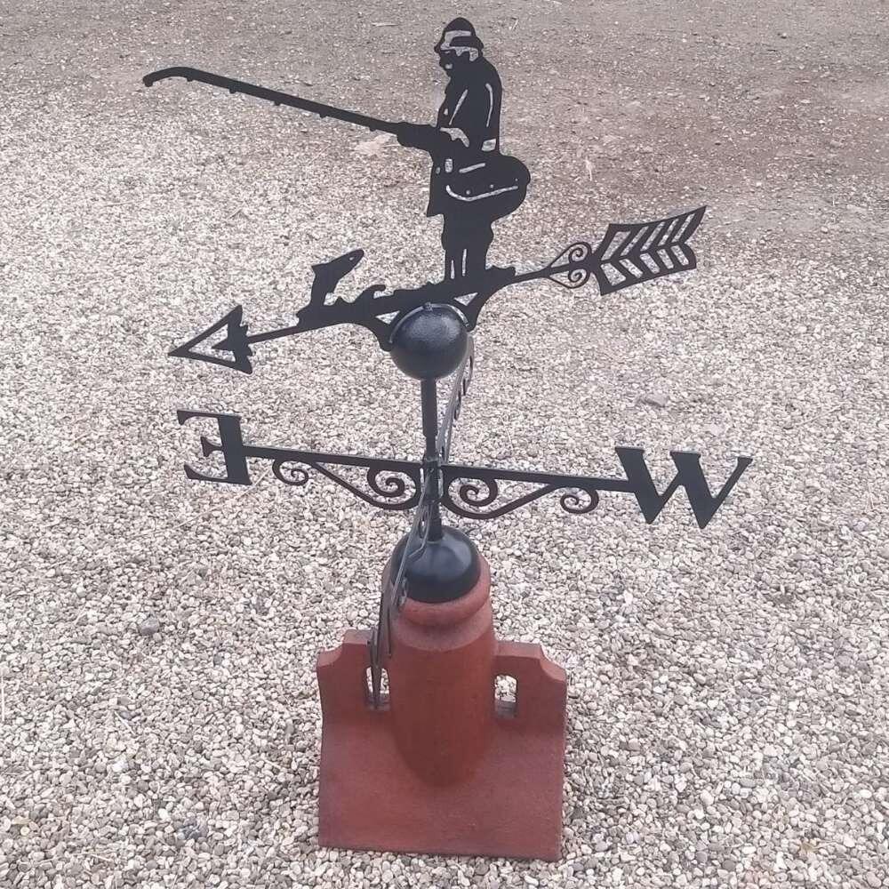 Fisherman weathervane fixed on a 45 degree ridge tile finial
