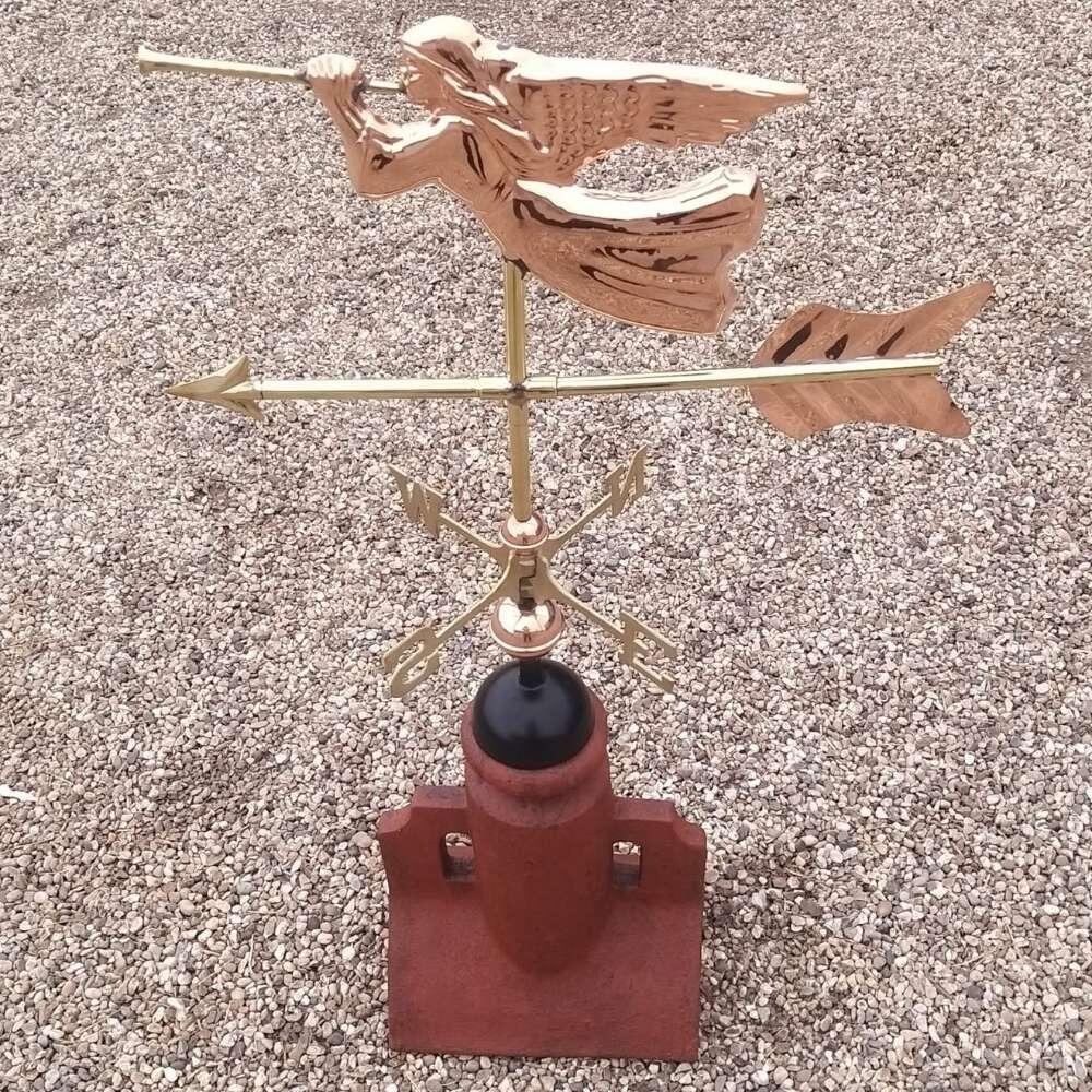 Angel weathervane fitted on a double arch angled 45 degree ridge tile finial