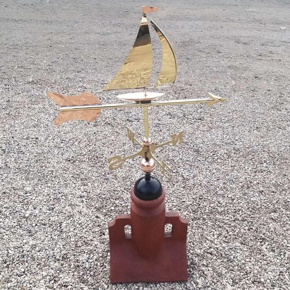 Sail boat weathervane fixed to a 45 degree ridge finial