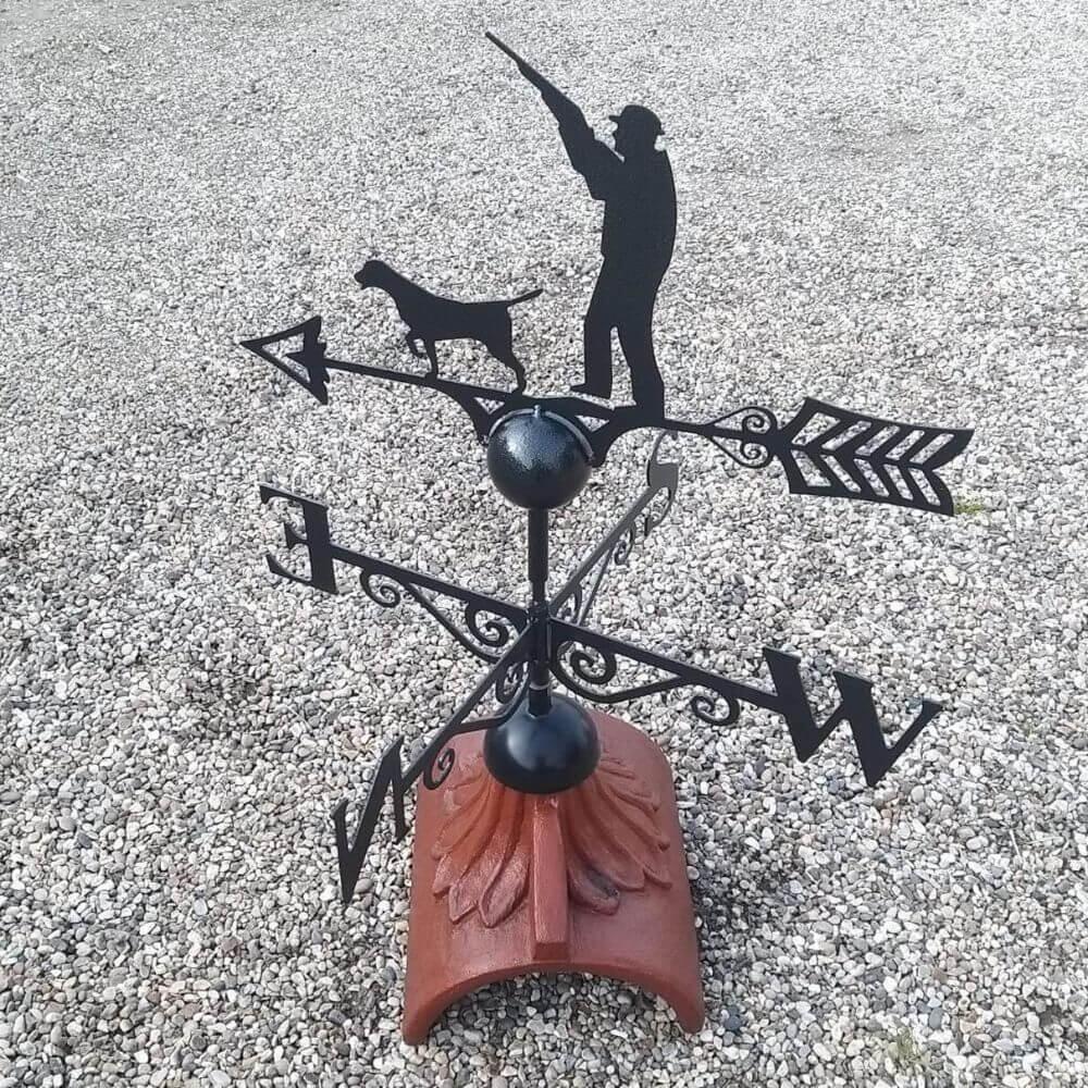 Gun up hunting weathervane installed on a half round ridge tile
