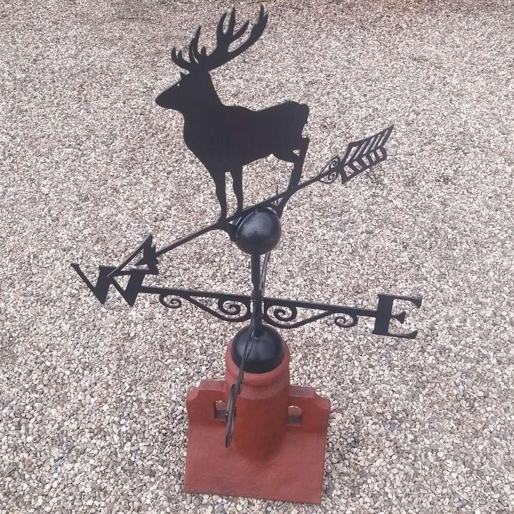 Stag weathervane fixed on a 45 degree ridge tile finial