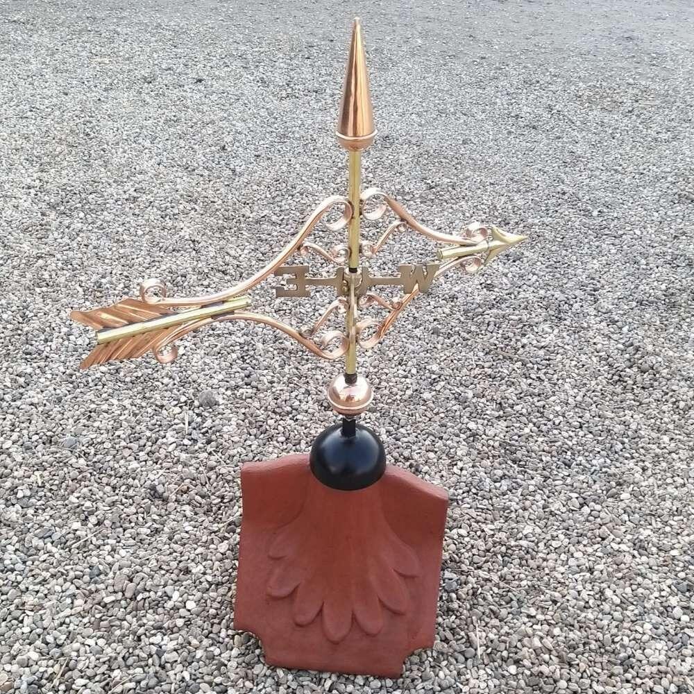 Victorian arrow weathervane installed on a ridge tile finial fitting with multiple angle options