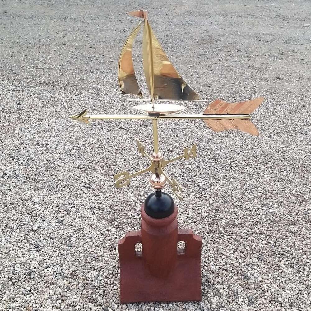 Sail boat weathervane fixed to a 45 degree ridge finial