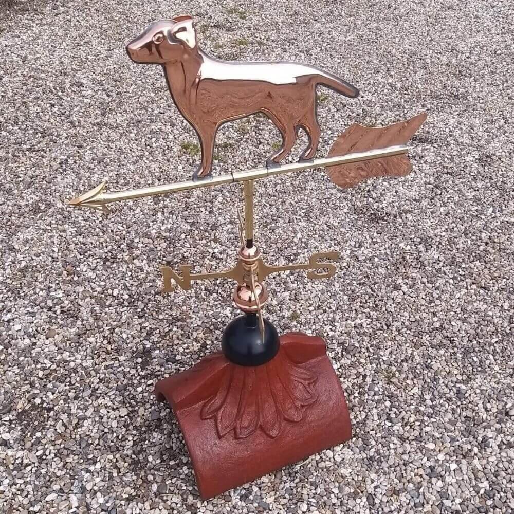 Labrador weathervane fixed to a half round tile
