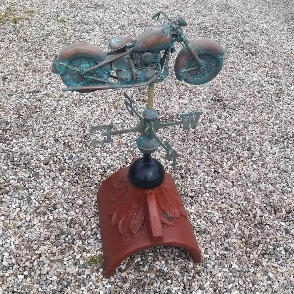 Motorbike weathervane mounted on a half round roof tile