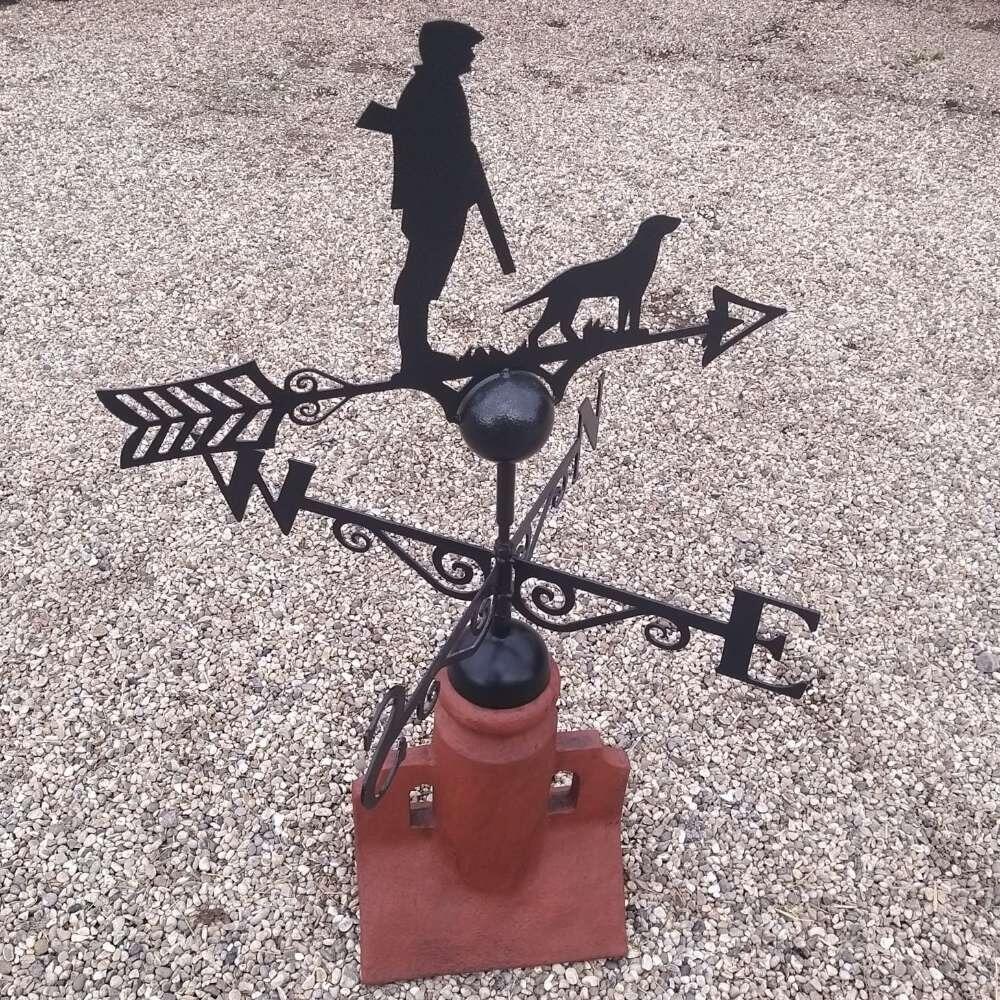 Hunting dog weathervane on a 45 degree ridge tile finial