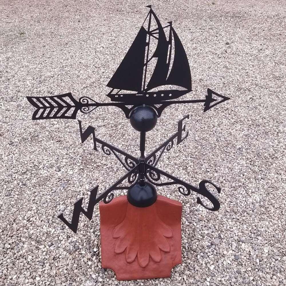 Boat weathervane on a ridge tile finial fitting with multiple angle options