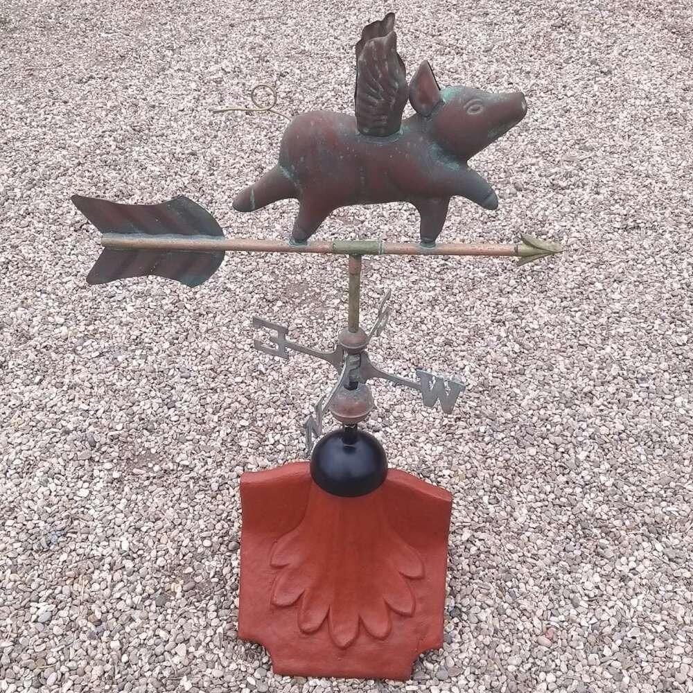 Flying pig verdigris weathervane on a ridge tile finial fitting with multiple angle options