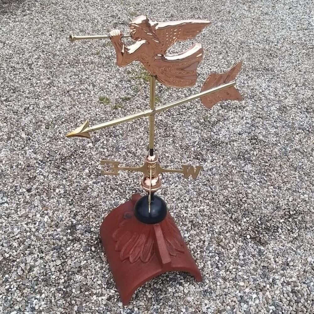 Angel weathervane installed on a half round ridge tile
