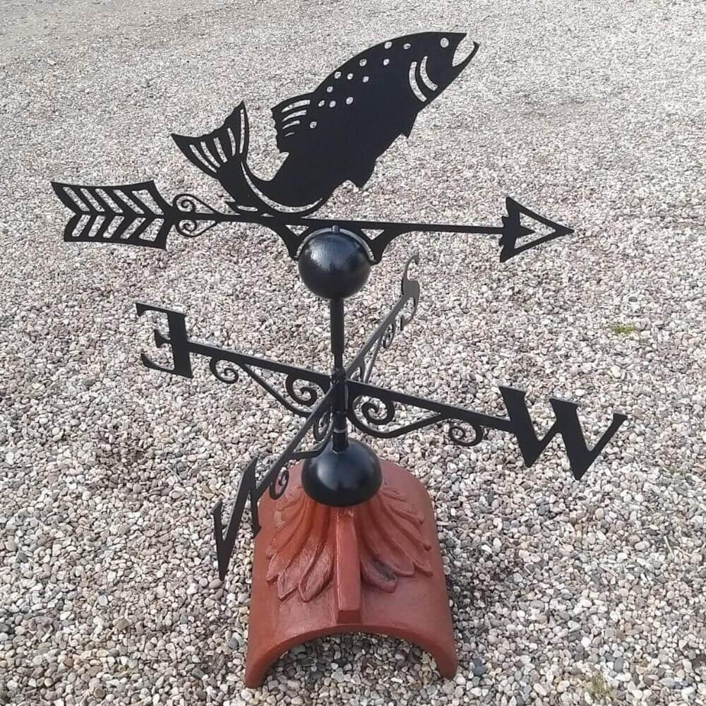 Fish weathervane fixed on a half round ridge tile
