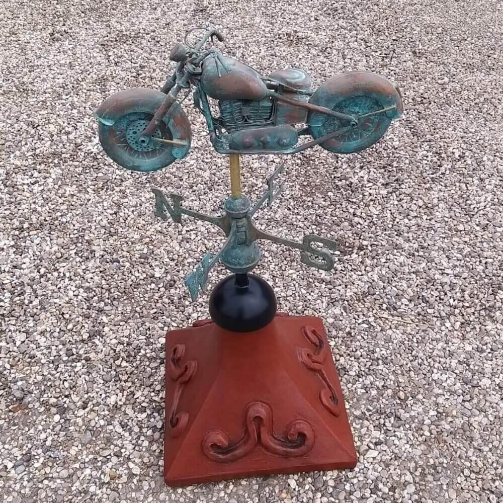 Motorbike weathervane fixed on a square roof tile capping