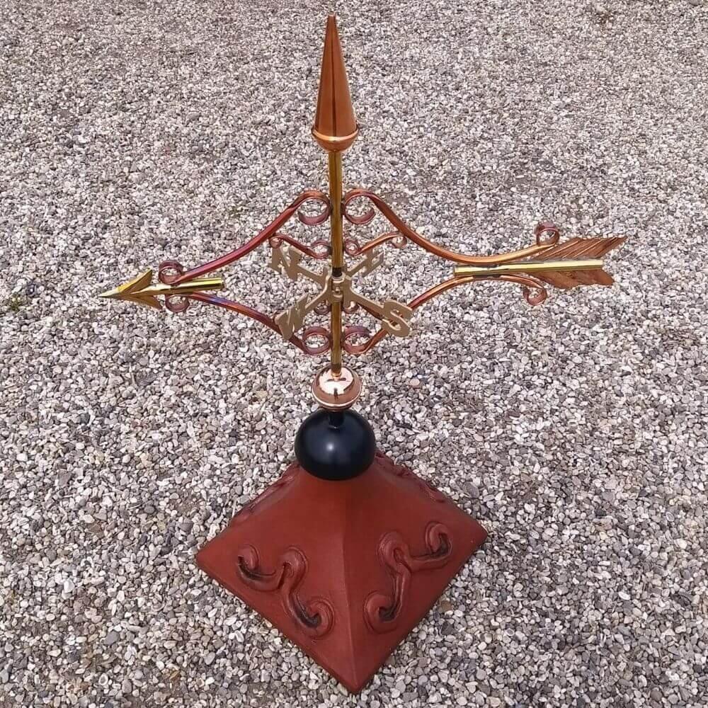 Victorian arrow weathervane installed on a square roof tile capping
