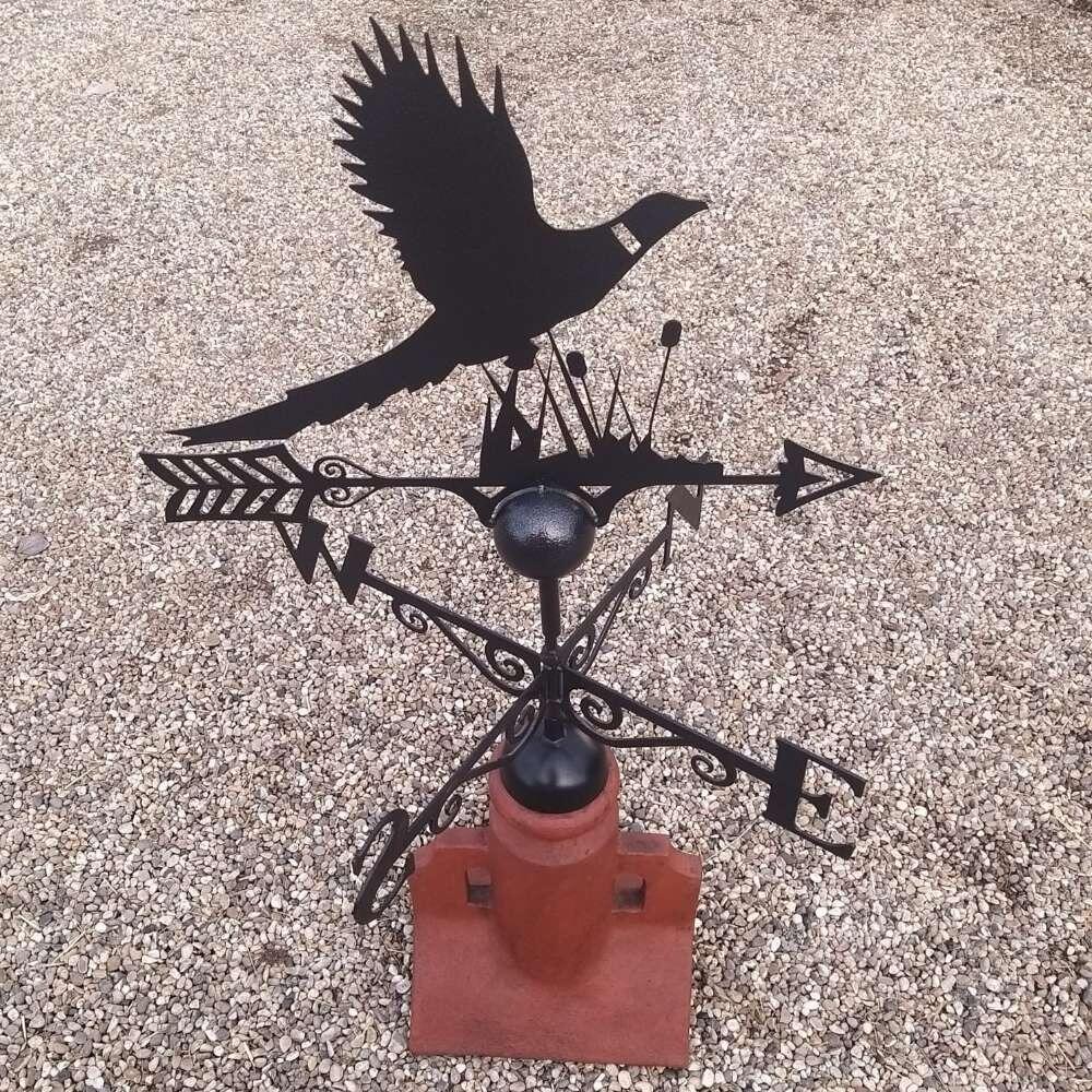 Pheasant weathervane installed on a 45 degree ridge tile finial