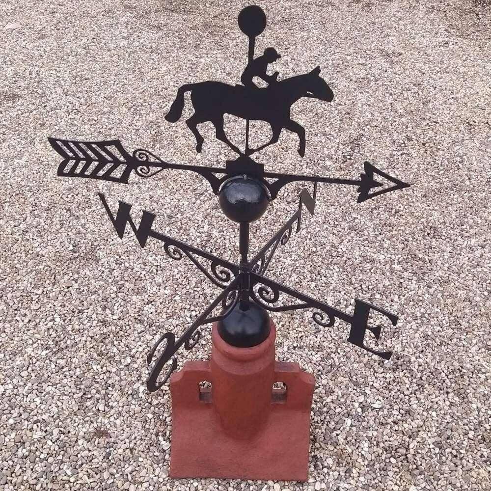 Winning post racing horse weathervane fitted to a 45 degree ridge tile