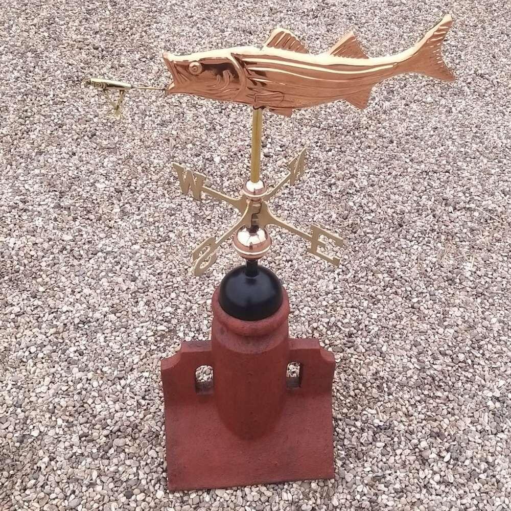 Fish copper weathervane installed on a 45 degree ridge finial