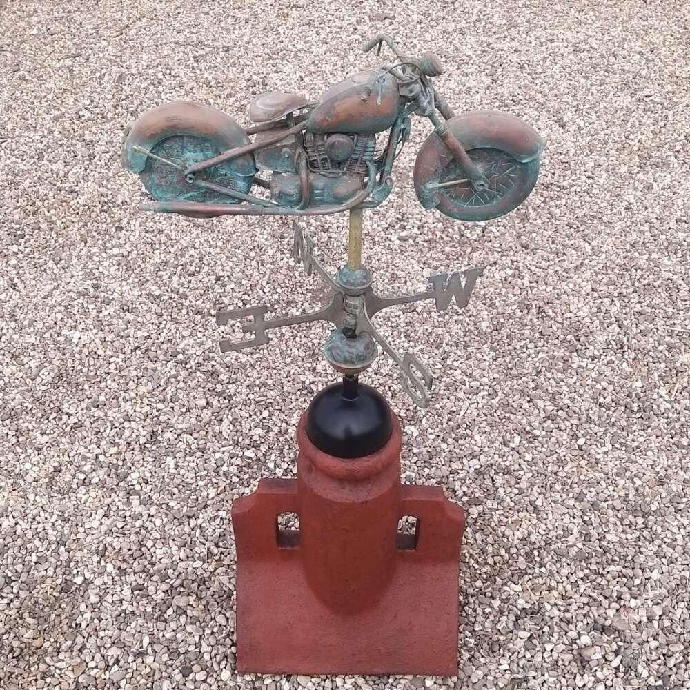 Verdigris motorbike weathervane supplied on a 90 degree ridge base finial