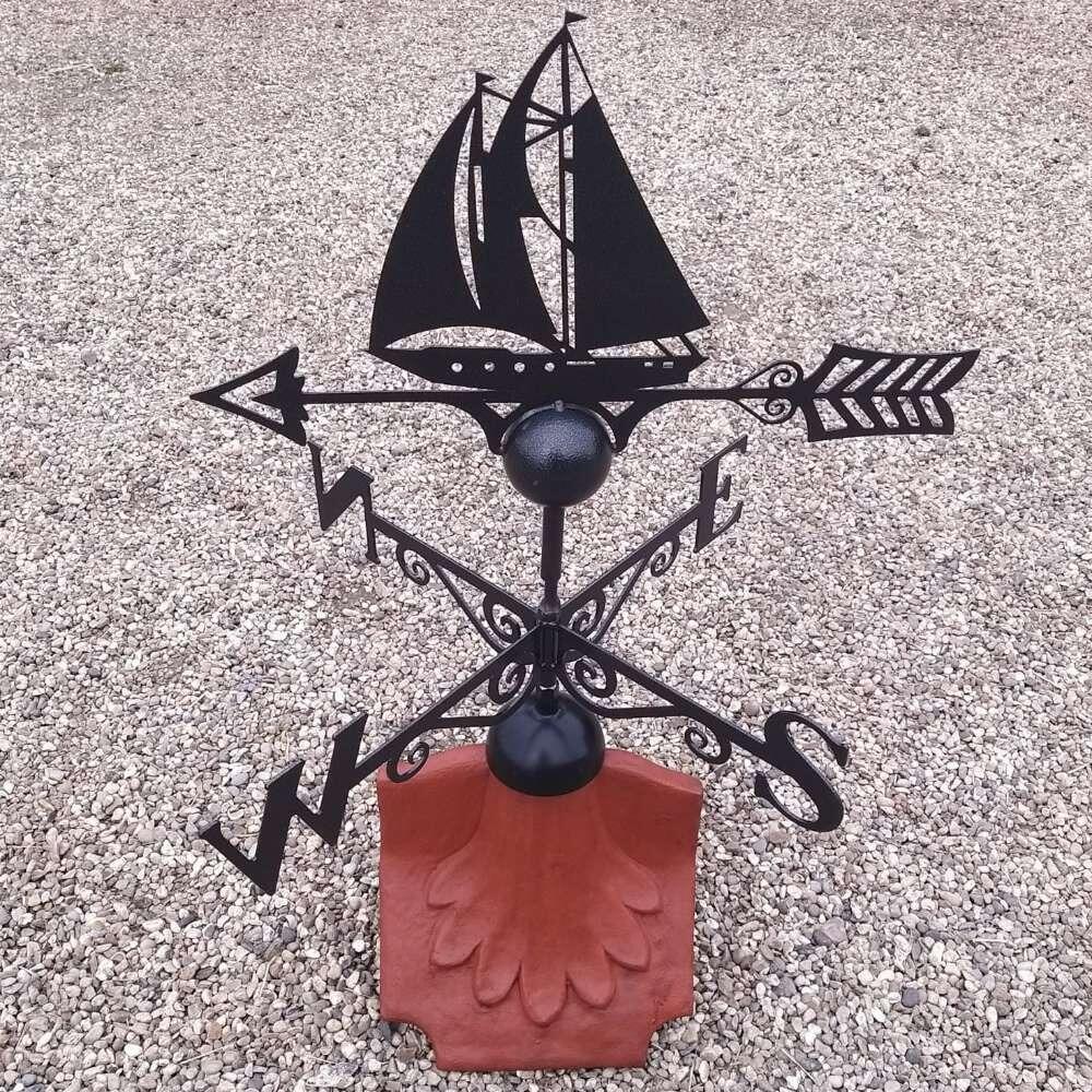 Boat weathervane on a ridge tile finial fitting with multiple angle options