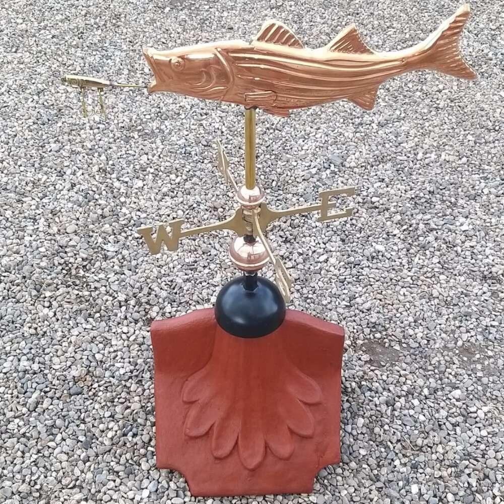 Fish weathervane fitted on a ridge tile finial fitting with multiple angle options