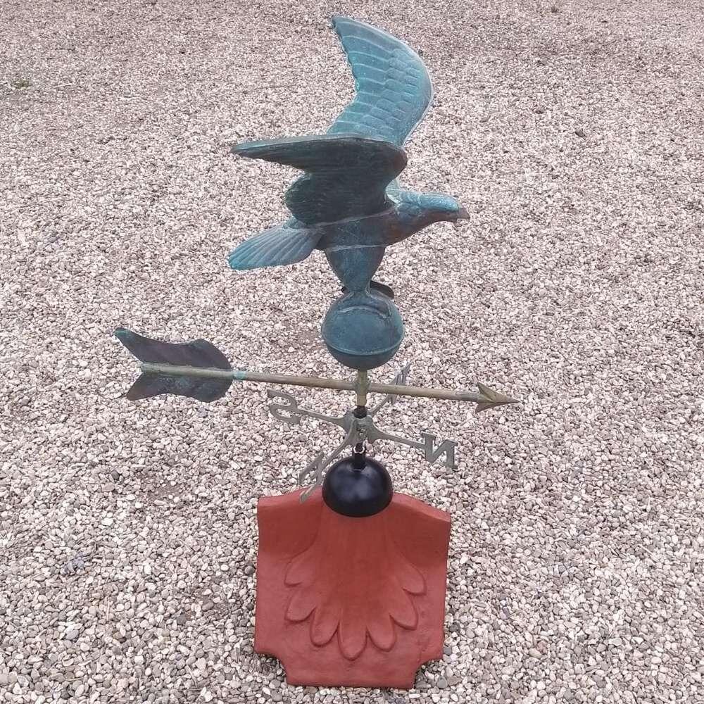 Eagle verdigris weathervane on a ridge tile finial fitting with multiple angle options
